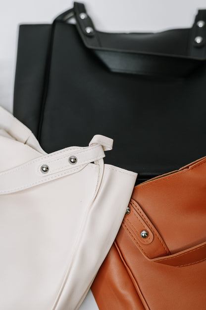 My Whole Life Shoulder Bag available in Black, Neutral and Camel with silver hardware and sleek faux leather finish.