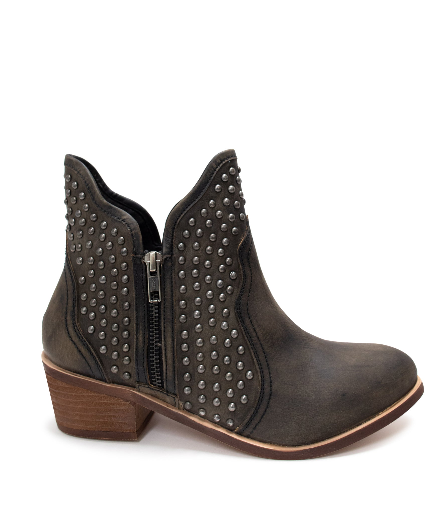 Black ankle boots with nail head stud accents, sleek leather finish, and an outside zipper for easy wear. Stylish and versatile footwear for casual or dressy occasions.