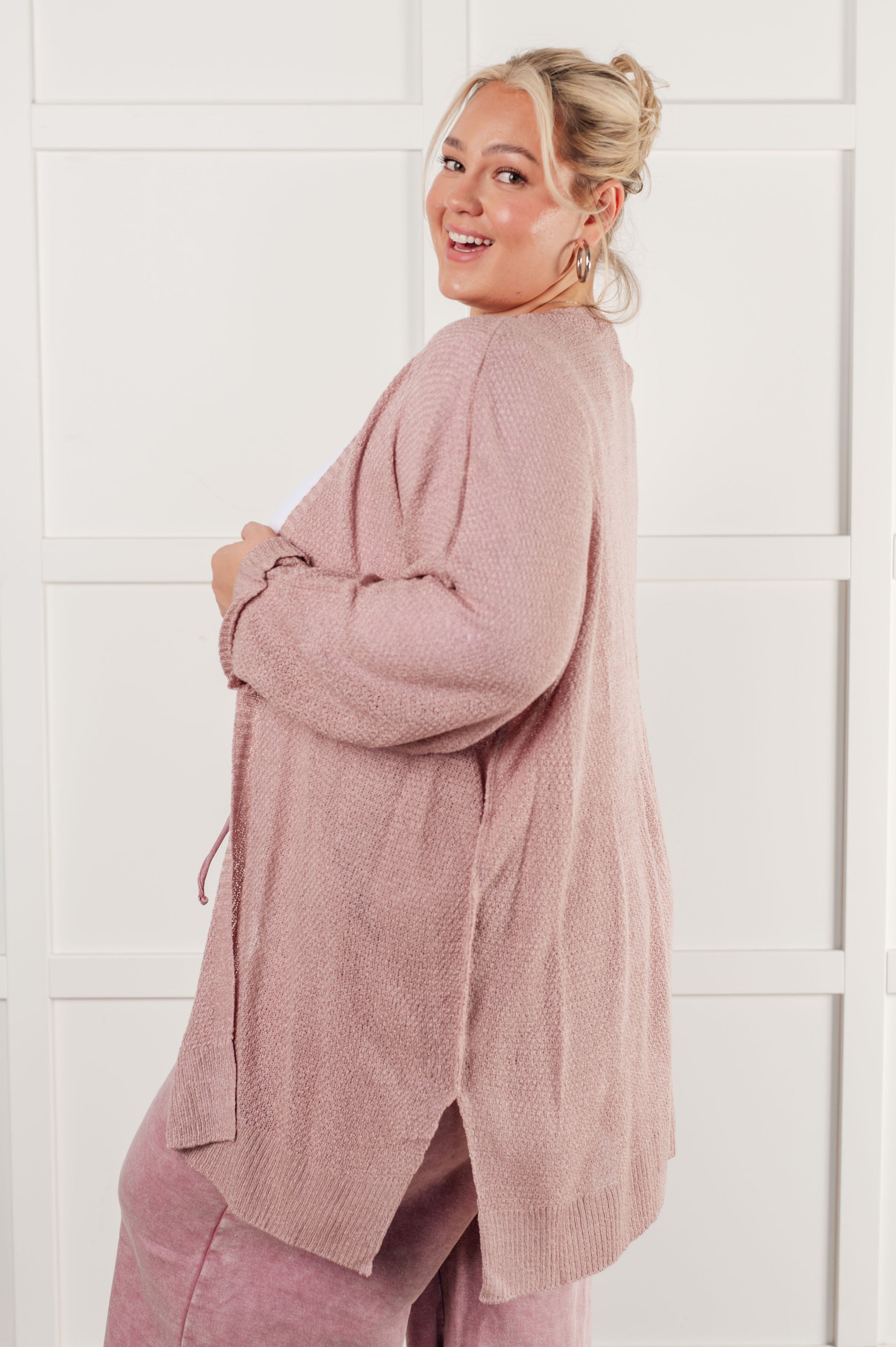 Nevina Cardigan in dusty pink, loose knit open front sweater with dolman sleeves, tacked cuffs, side slits, and banded ribbed trim. Cozy and stylish addition to your wardrobe.