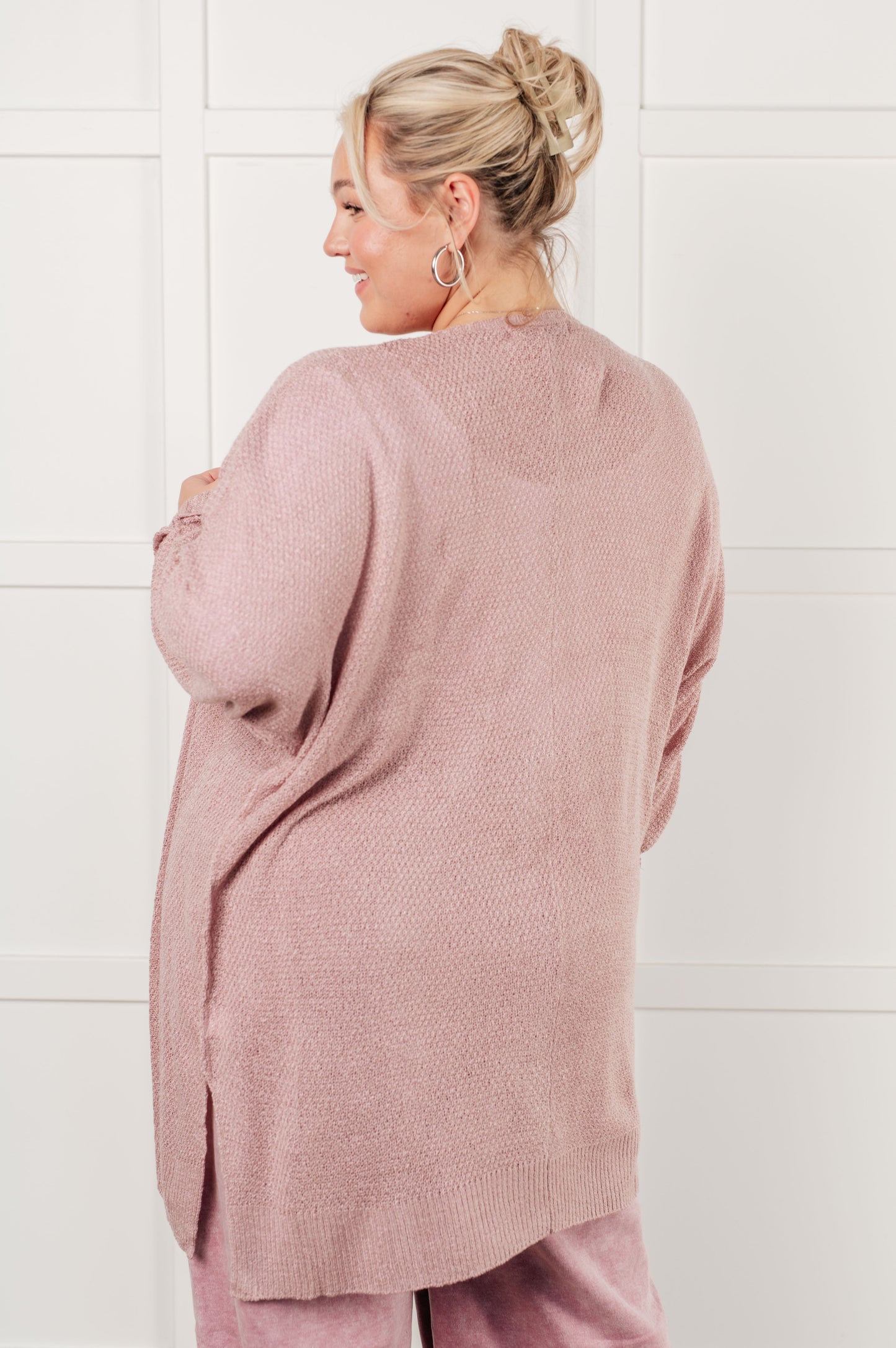 Nevina Cardigan in dusty pink, loose knit open front sweater with dolman sleeves, tacked cuffs, side slits, and banded ribbed trim. Cozy and stylish addition to your wardrobe.