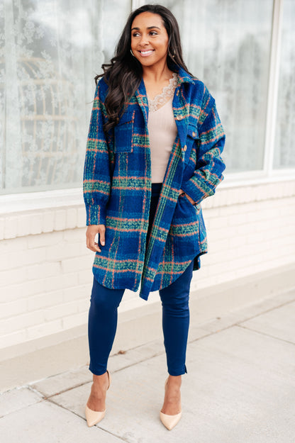 Woman wearing Nona Plaid Coat in blue with collared neckline and button front closure.