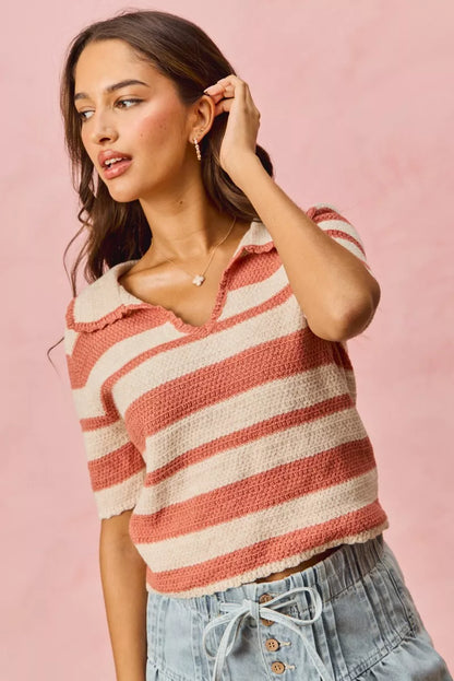 Model wearing Noreen Stripe Short Sleeve Cropped Sweater in cream and pink stripes.