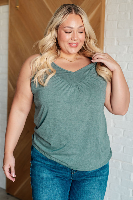 Plus size model wearing the Nala V-Neck Tank in Mist, featuring a flattering V-neckline, sleeveless design, and chic ruched detailing for versatile style.