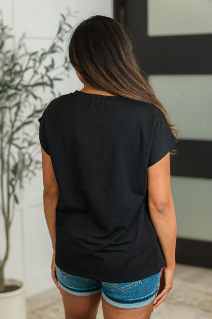 Hallie Pocket Tee in black with dolman sleeves and relaxed fit, crafted from soft French Terry fabric.
