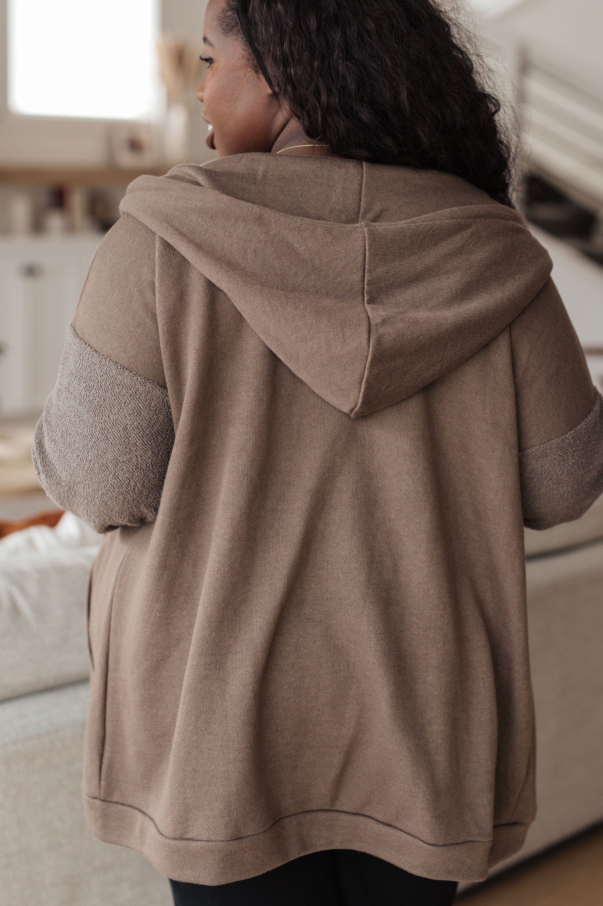 Taupe zip-up hoodie with French terry fabric, reverse-french terry sleeves, a hooded neckline, and long dropped shoulder sleeves.