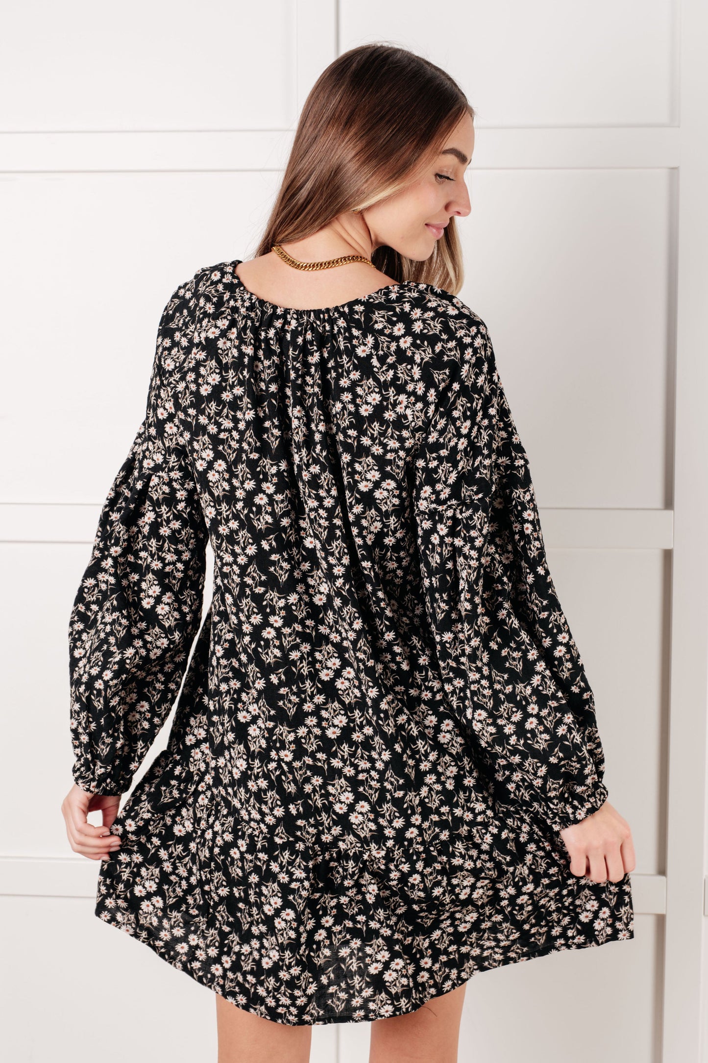 Back view of Onna V-Neck Floral Dress with full lining and flowy babydoll fit.