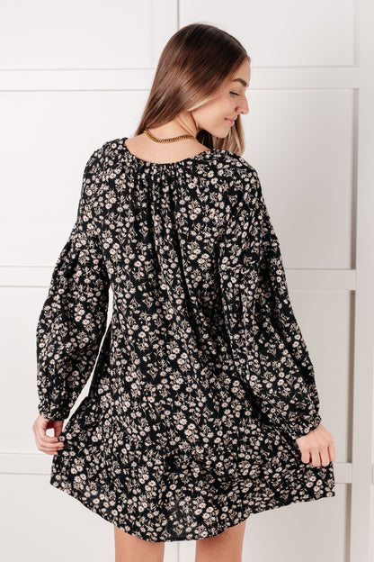 Back view of Onna V-Neck Floral Dress with full lining and flowy babydoll fit.