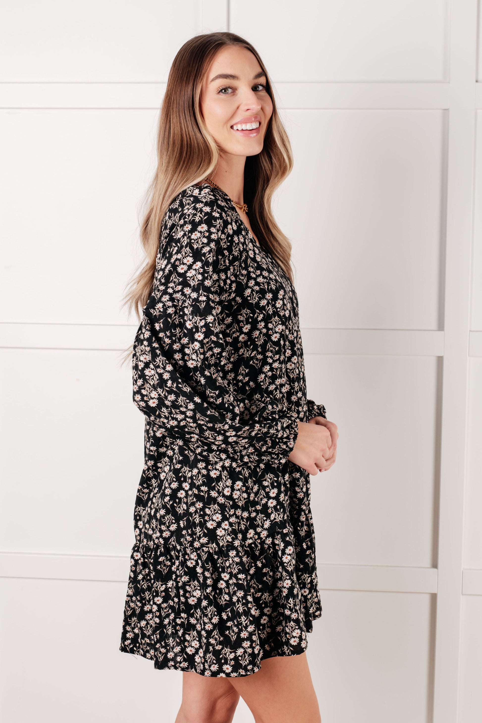 Side angle of Onna V-Neck Floral Dress highlighting long balloon sleeves.