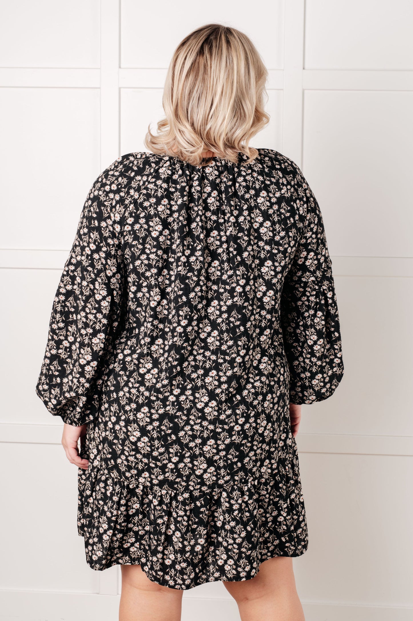 Back view of plus size Onna V-Neck Floral Dress showing lined mini-length design.