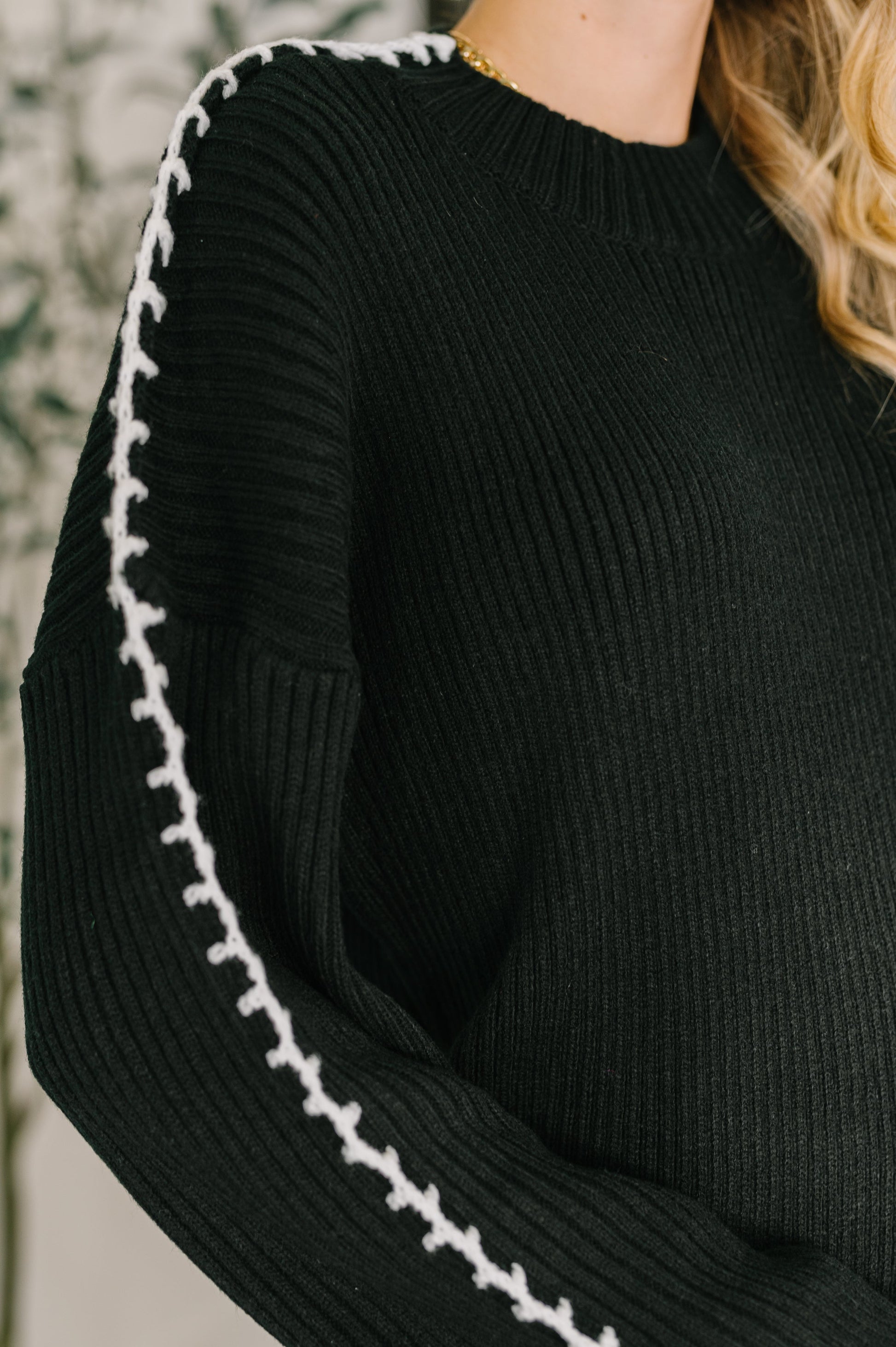 Close-up of Onyx Stitch Pullover showing crocheted blanket stitch detailing.