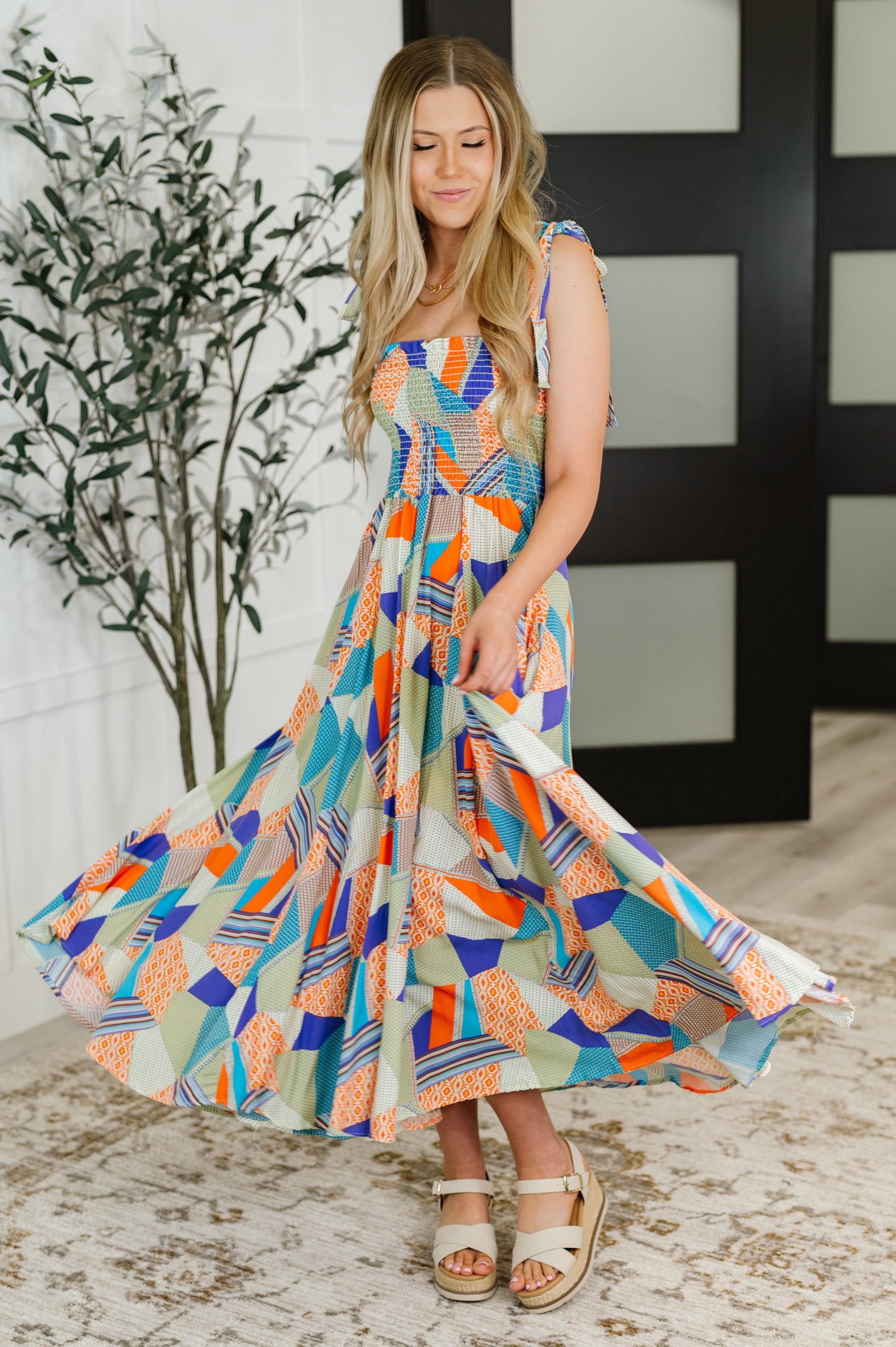 Model twirling in the Wrenleigh Multicolor Maxi Dress, showcasing its flowy fabric and vibrant, playful design.