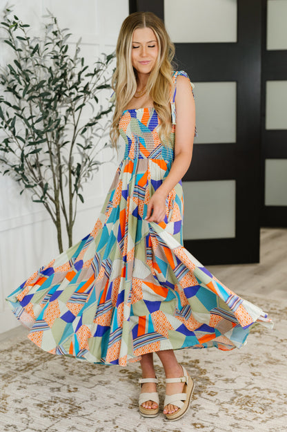 Model twirling in the Wrenleigh Multicolor Maxi Dress, showcasing its flowy fabric and vibrant, playful design.