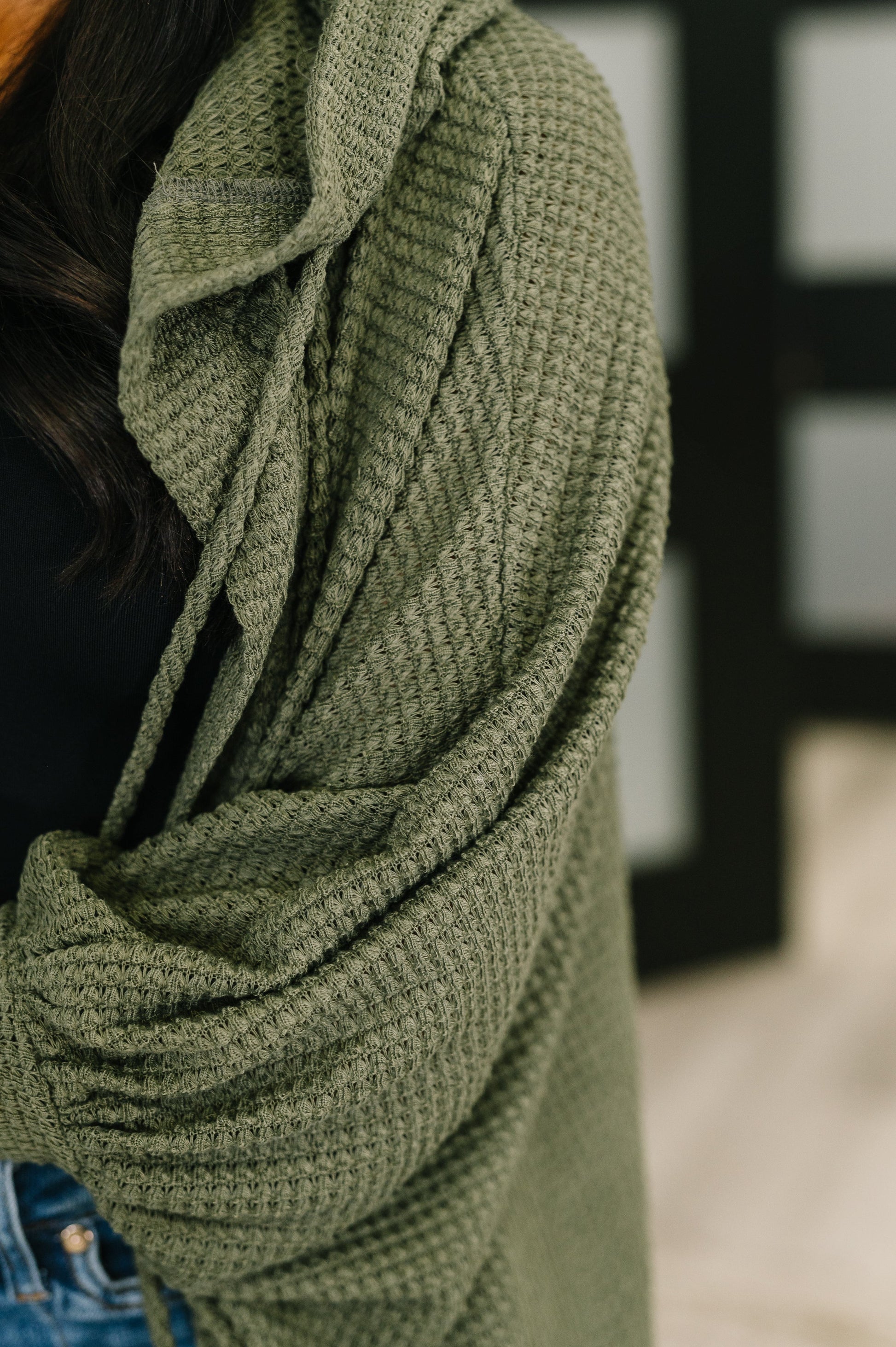 Close-up of Remington Hooded Cardigan in olive highlighting waffle knit fabric and soft texture.