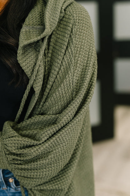 Close-up of Remington Hooded Cardigan in olive highlighting waffle knit fabric and soft texture.