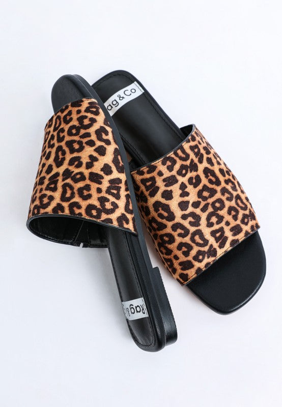 Side view of Everyday Panthera Leopard Print Slider Flats leopard print microfiber upper.