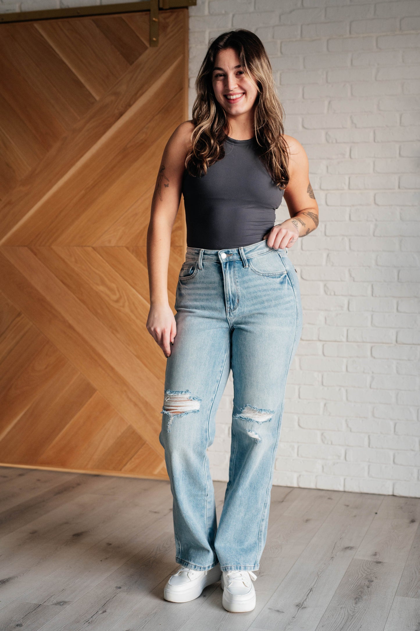 90s-inspired Patricia High Rise Rigid Magic Straight Jeans in a distressed light wash, featuring a classic straight-leg fit and a comfortable cotton-stretch denim blend for timeless style.