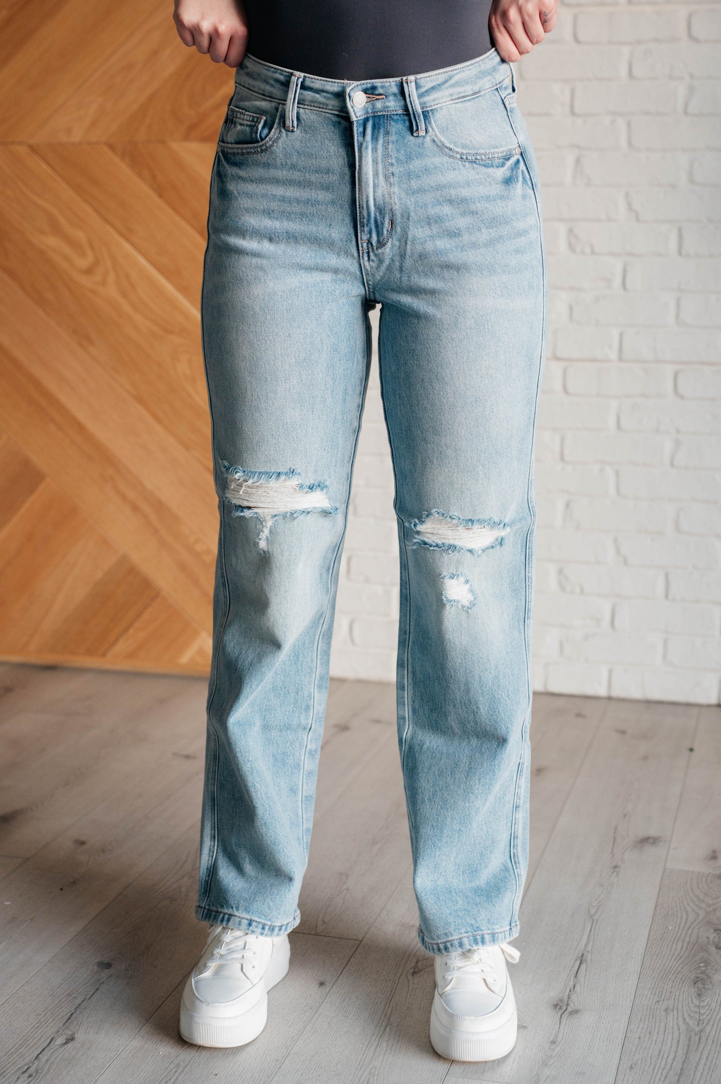 90s-inspired Patricia High Rise Rigid Magic Straight Jeans in a distressed light wash, featuring a classic straight-leg fit and a comfortable cotton-stretch denim blend for timeless style.