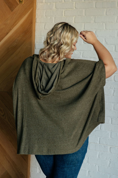 Plus size model back view showing poncho drape