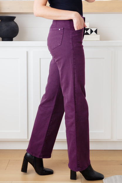 Side view of Petunia Plum Wide Leg Jeans showing contour seaming and double-button waistband.