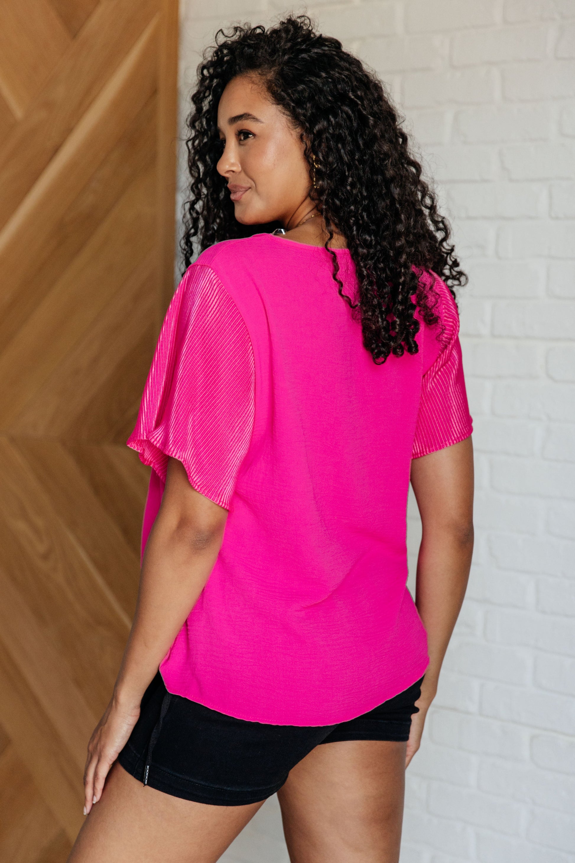 Soft and stylish Peyton short sleeve top with textured woven fabric, ideal for versatile outfits.