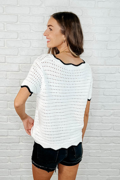 Back view of Pixie White Knit Top highlighting eyelet knit texture and hemline details