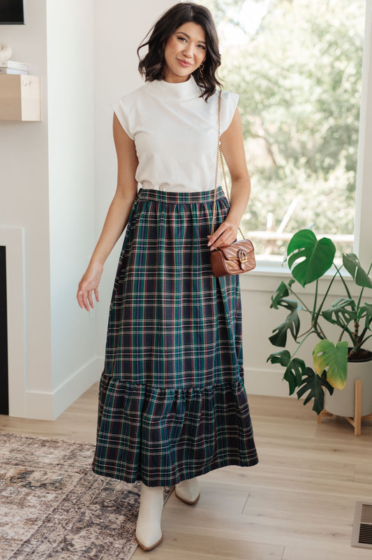 Plaid Perfection Maxi Skirt in emerald green, featuring a high-rise waist, tiered ruffle hem, and back elastic waistband for a comfortable fit.