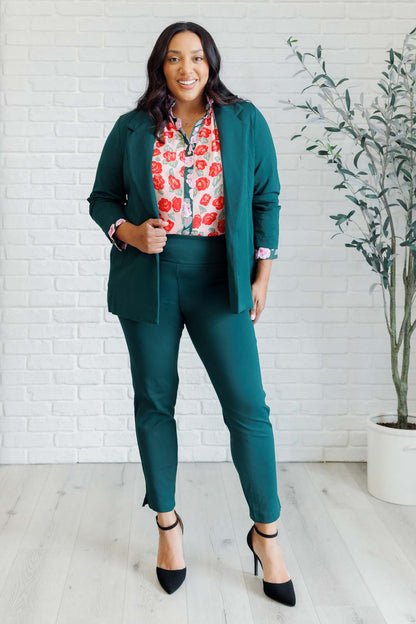 Plus size full body view of Gisselle Mixed Print Blouse styled with jeans showing playful ruffle detail.