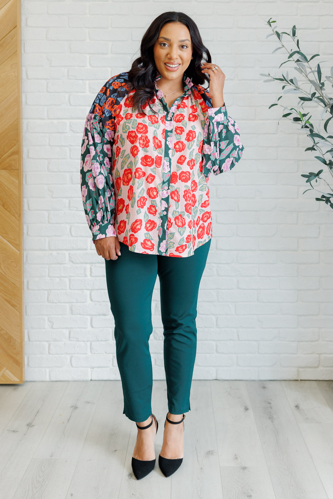 Priscilla Mixed Print Blouse with multicolor block color floral prints, high neckline, front button closures, balloon sleeves with banded cuffs, and playful ruffle detailing.