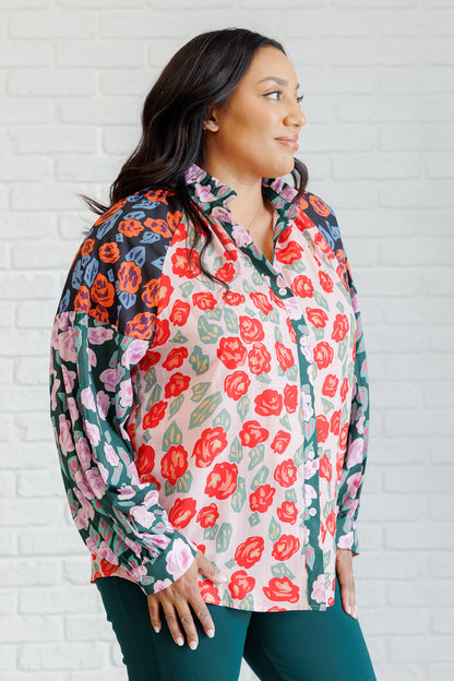Plus size side view of Gisselle Mixed Print Blouse showing balloon sleeves and high neckline
