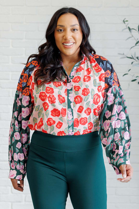Plus size front view of Gisselle Mixed Print Blouse showing high neckline, ruffle detail, and balloon sleeves.