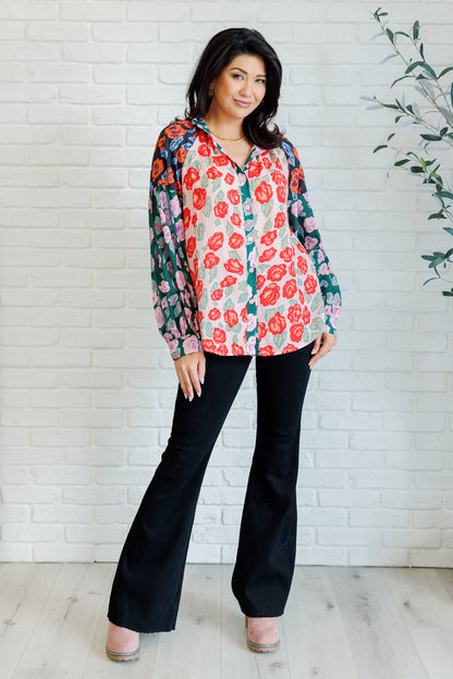 Full body view of Gisselle Mixed Print Blouse styled tucked into jeans highlighting statement sleeves