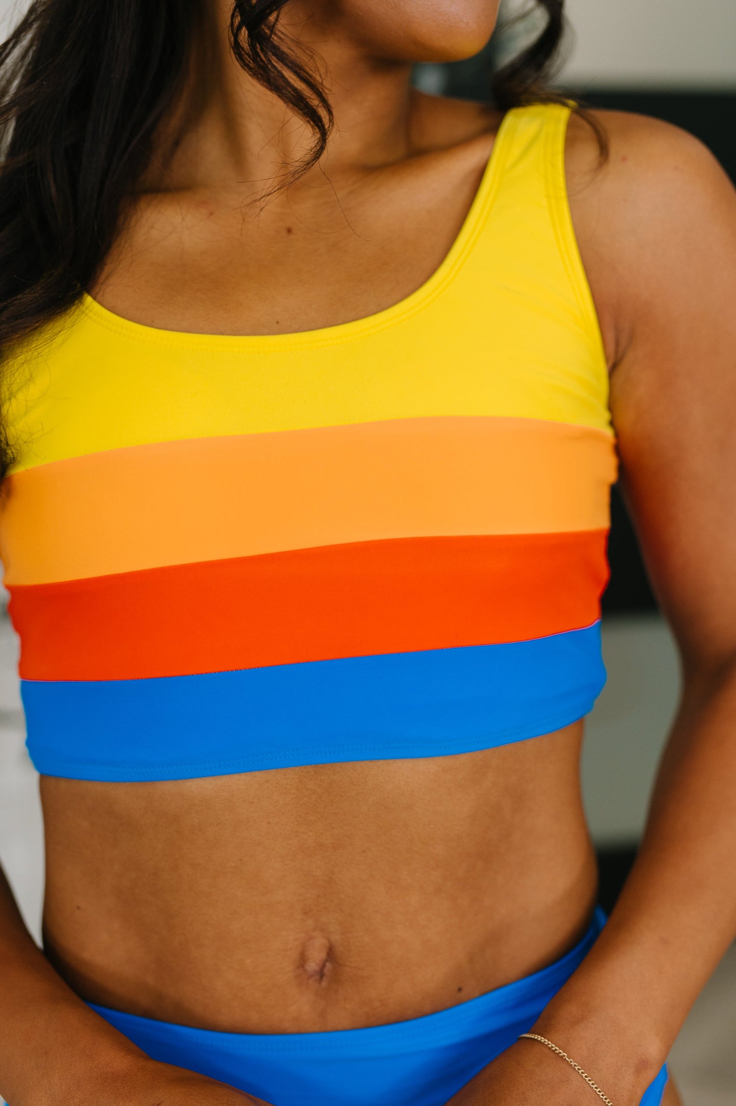 Close up of Primary Choice Ruched Swim Set stripe pattern and fabric detail.