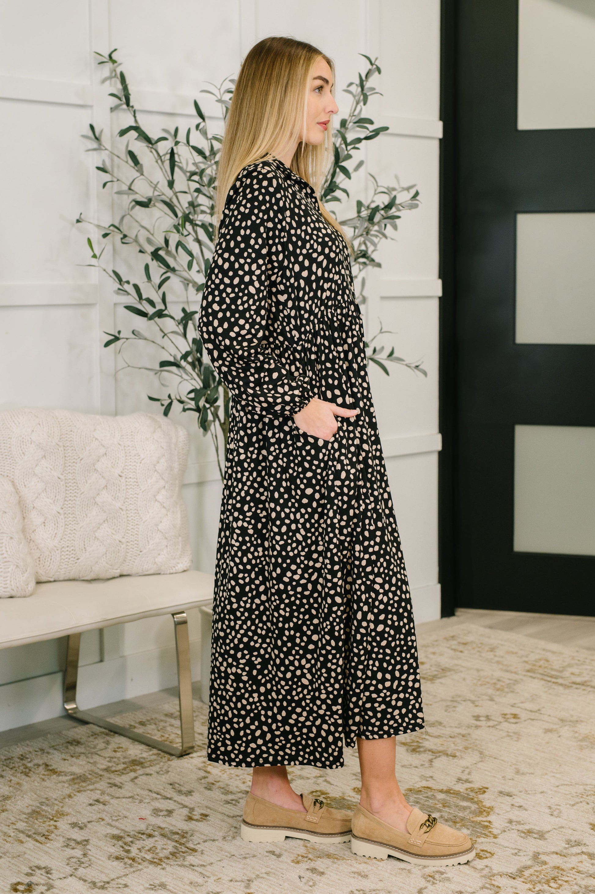 Side angle of Pru Collared Dress highlighting spotted jersey knit and side pockets.