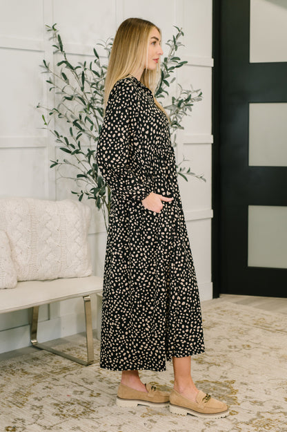 Side angle of Pru Collared Dress highlighting spotted jersey knit and side pockets.