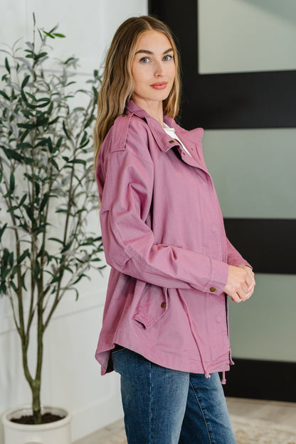 Side view highlighting waist drawstring and functional pocket