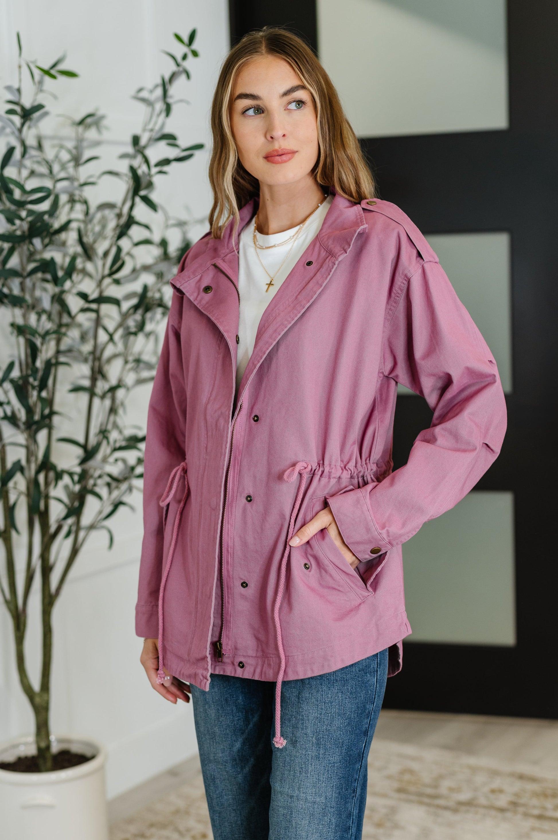 Front view showing collared neckline and pleated sleeve details