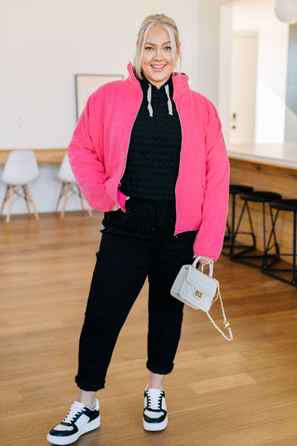 Front view of plus size Quinton Quilted Jacket showing mock neck and side pockets.