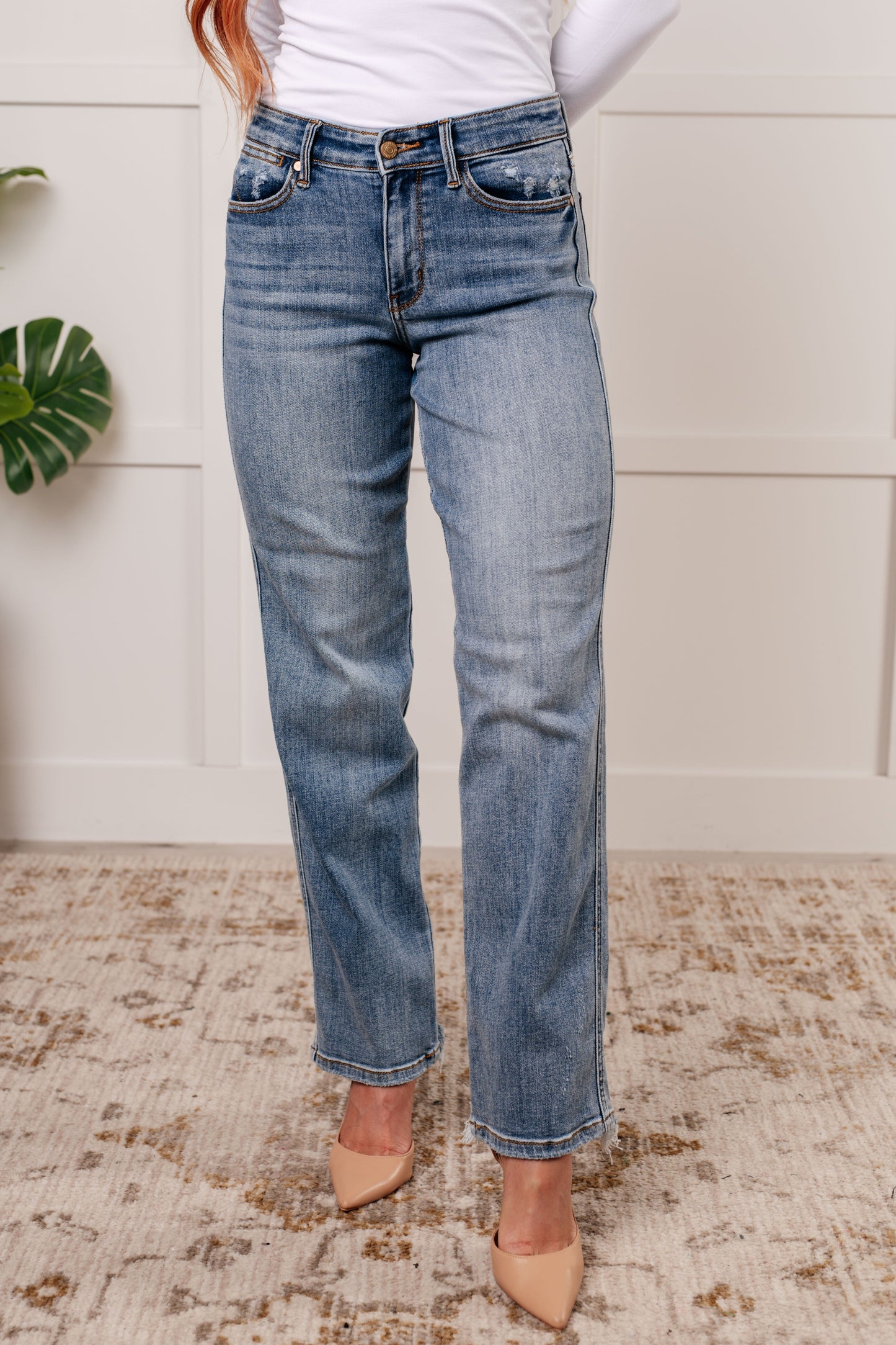 Mid Rise Cell Phone Pocket Dad Jeans in light wash by Judy Blue, featuring a hidden cell phone pocket, straight cut, and comfortable mid-rise fit.