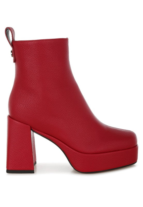 Red Poulin Chelsea Boots angled view showcasing block heel and smooth faux leather.