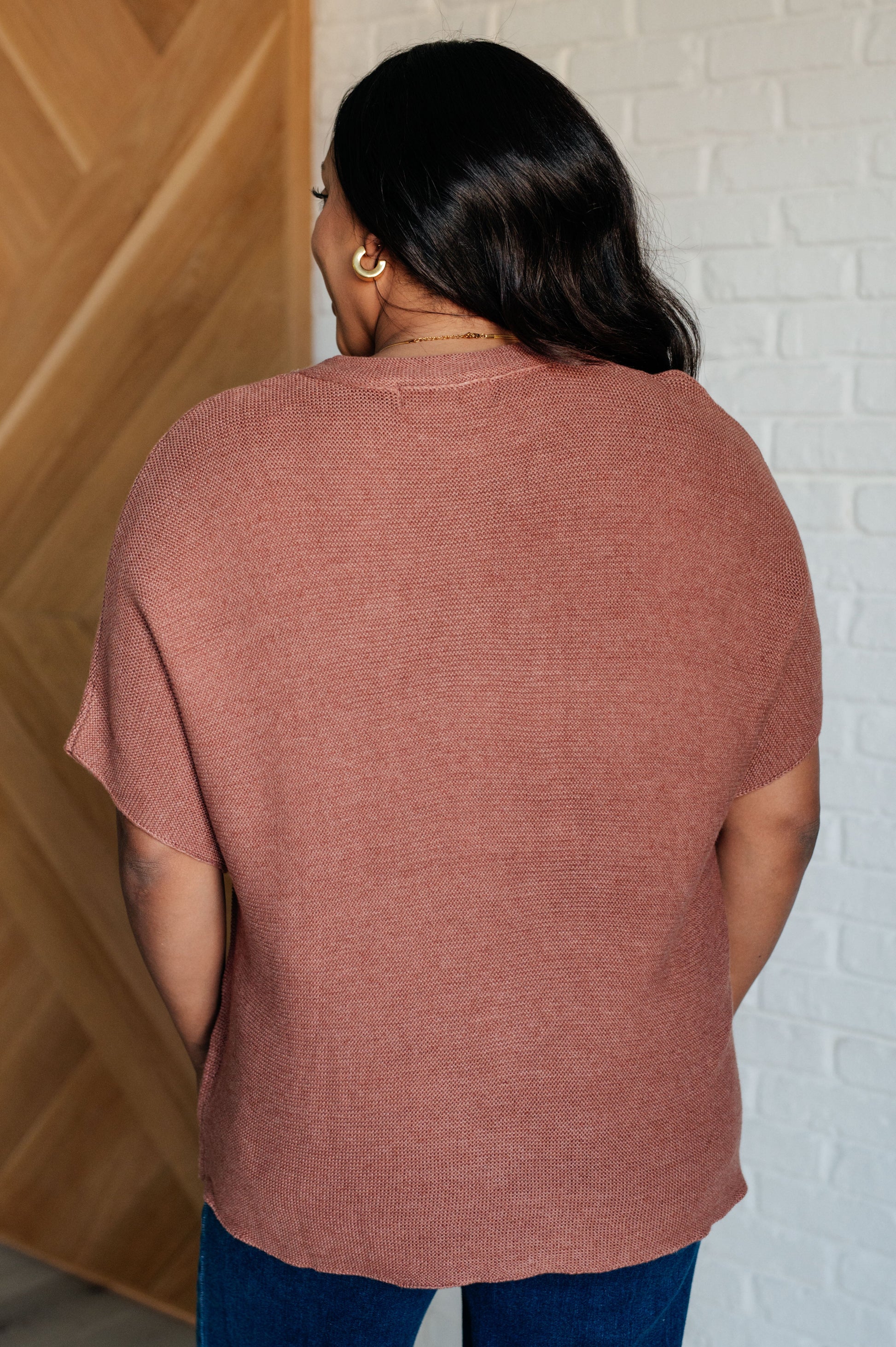 Coffee-colored sweater knit top with a round neckline, short batwing sleeves, and high stretch for comfort.