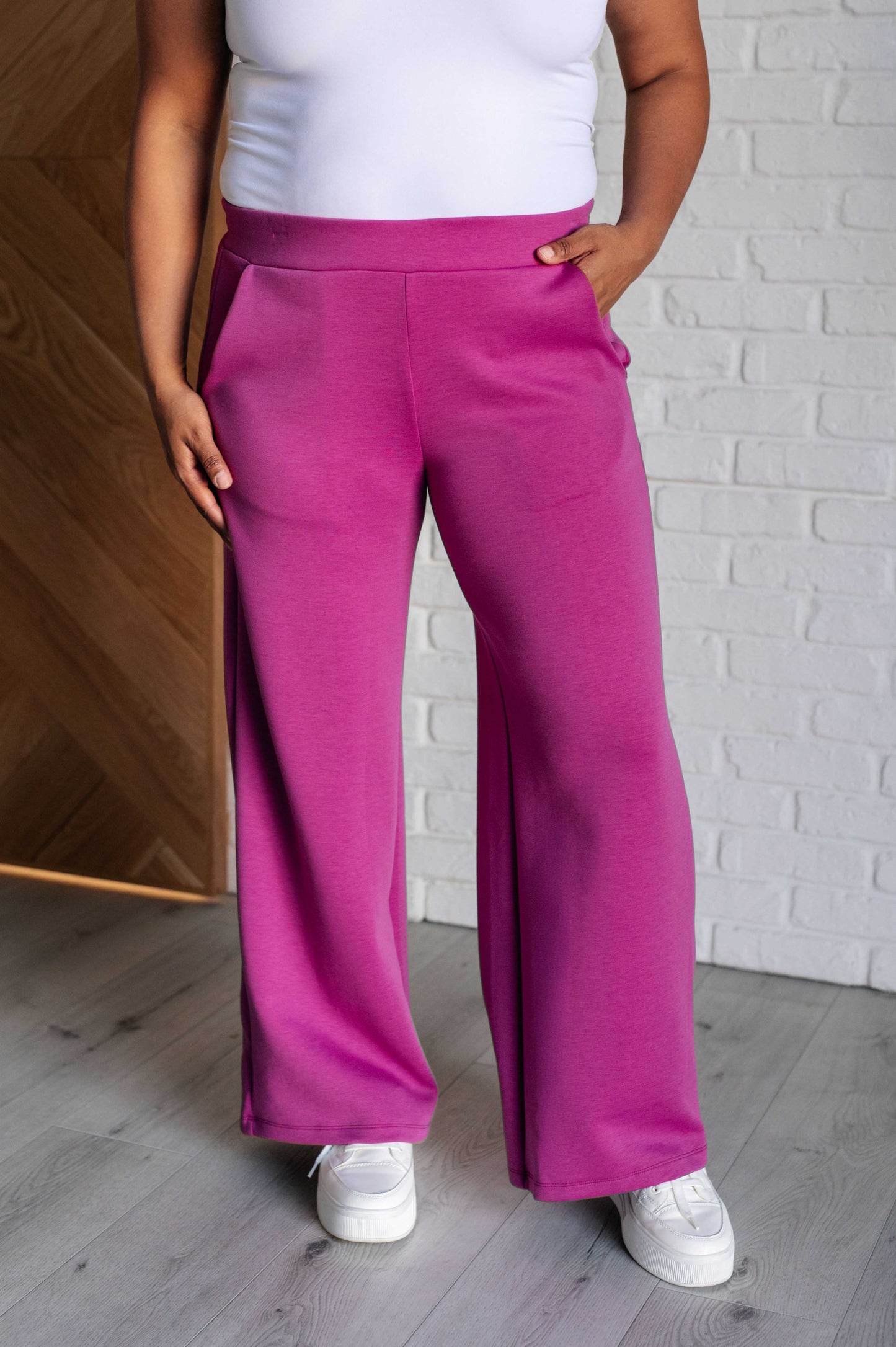 Women's magenta Hampton Wide Leg Crop Pants with a trendy wide-leg design, elastic waistline, and functional side pockets, made from scuba modal fabric.