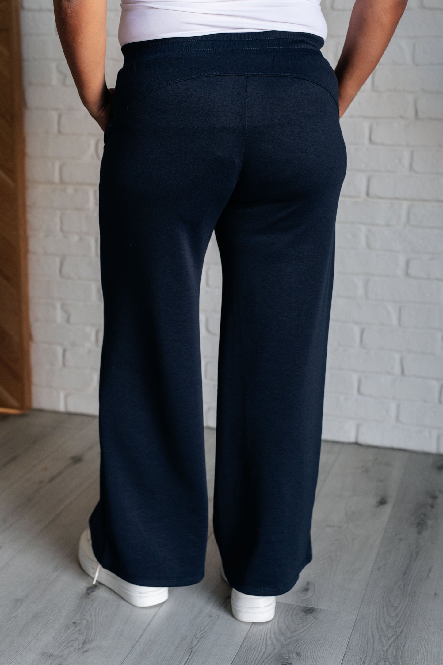 Women's navy  wide leg crop pants with a trendy wide-leg design, elastic waistline, and functional side pockets, made from scuba modal fabric.