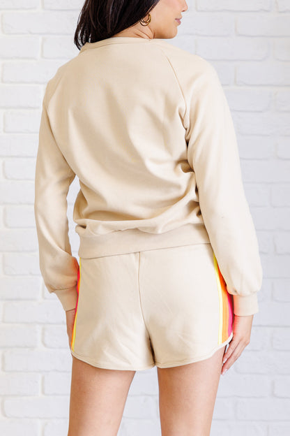 Back view of Retro Rainbow Shorts Set with solid tan knit fabric and relaxed lounge fit.