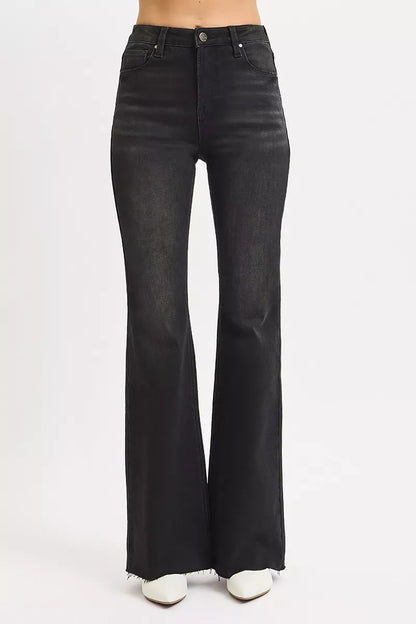Size inclusive front view in Rhonda High Rise Flare Jeans, raw hem black denim