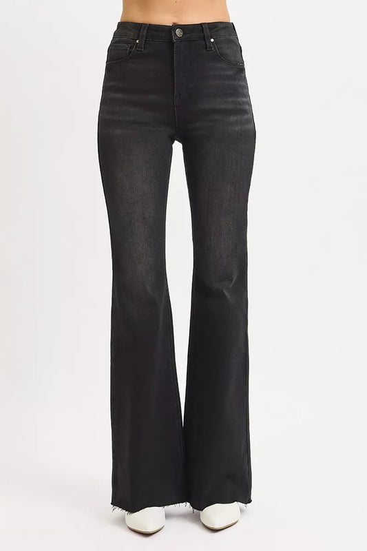 Size inclusive front view in Rhonda High Rise Flare Jeans, raw hem black denim