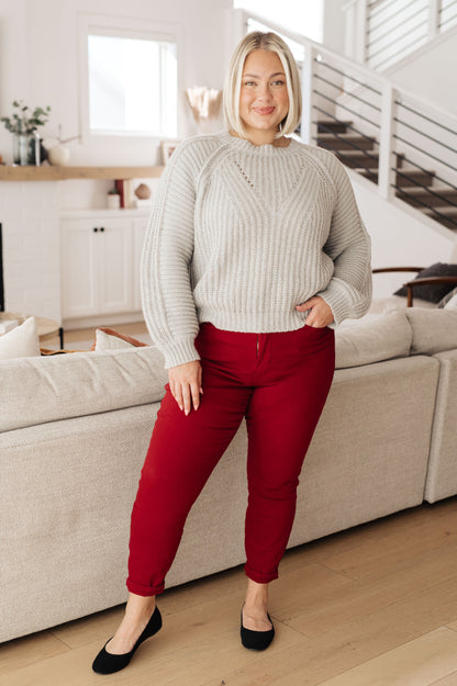 Plus size model in Hattie Balloon Sleeve Sweater with red pants and flats.