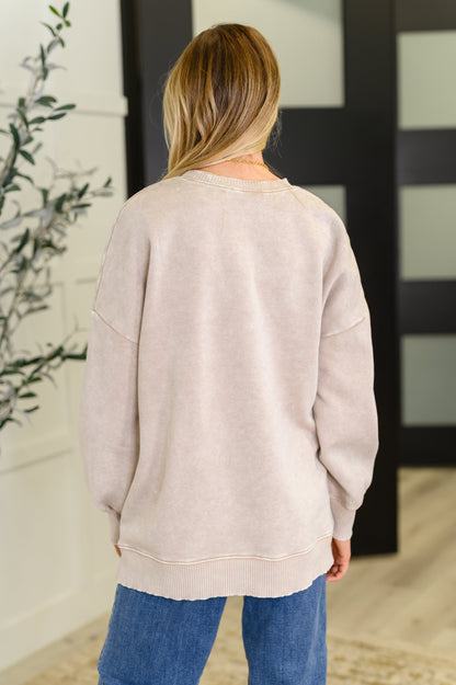 Back view of Safina Mineral Wash Pullover in light olive with relaxed drop shoulder and ribbed hemline.