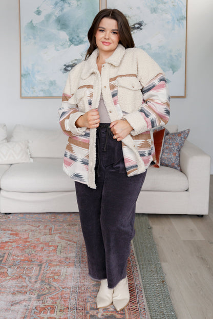 Plus size Sedona Sunset Shacket showing cozy sherpa fleece and Aztec design.