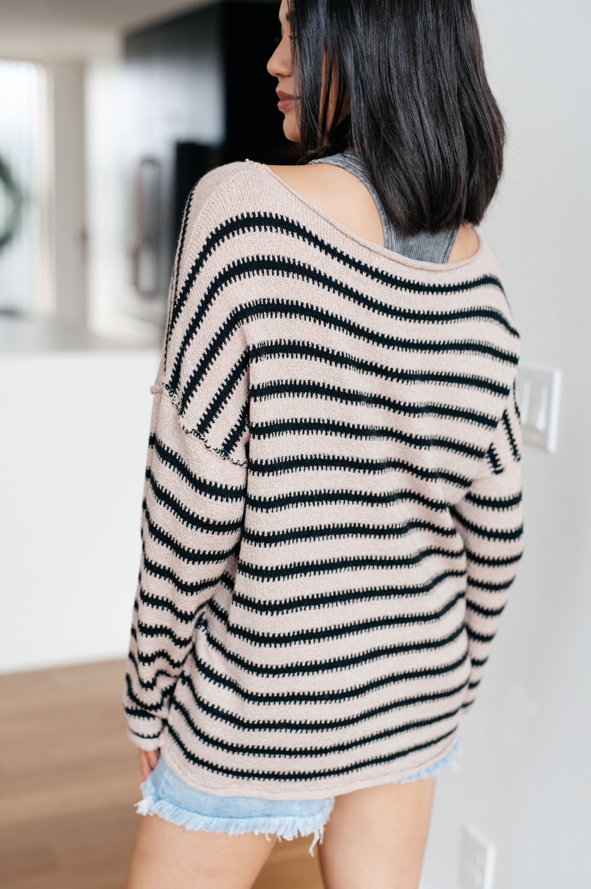 Back view of Selma Striped Sweater showing mid-weight knit and relaxed fit.
