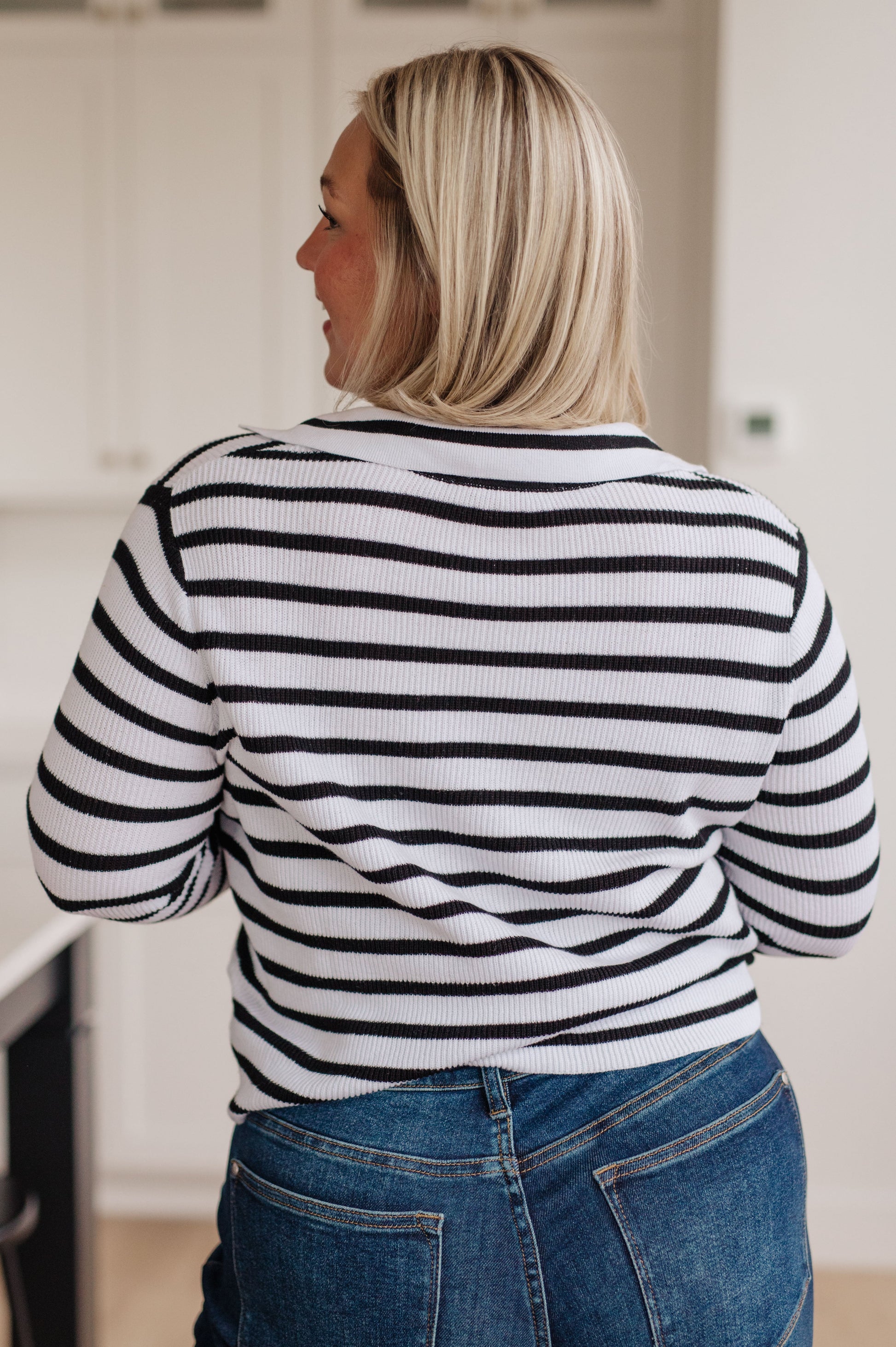 Women's lightweight ribbed striped sweater with a collared V-neckline, long sleeves, and a comfort fit. Made from 100% cotton.